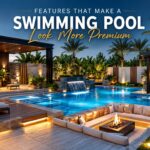 Luxury villa swimming pool with premium landscaping, pergola, outdoor lighting, waterfall feature, and modern seating area in Dubai.