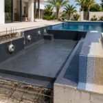 Pool waterproofing membrane applied during swimming pool construction in Dubai